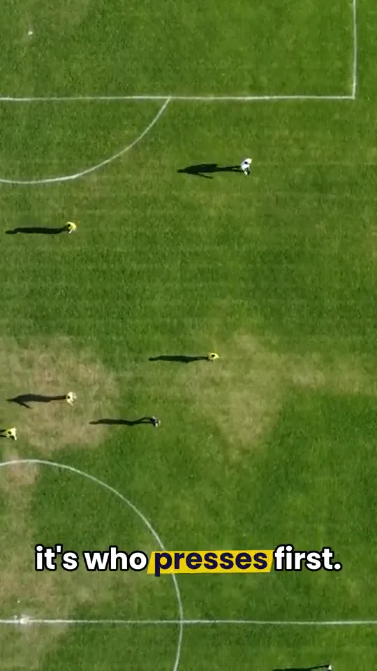 A match seen from high above, with the caption “who presses first”
